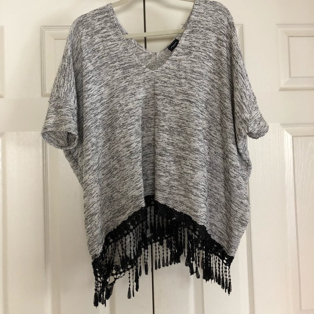 Black and white sweater with tassels
